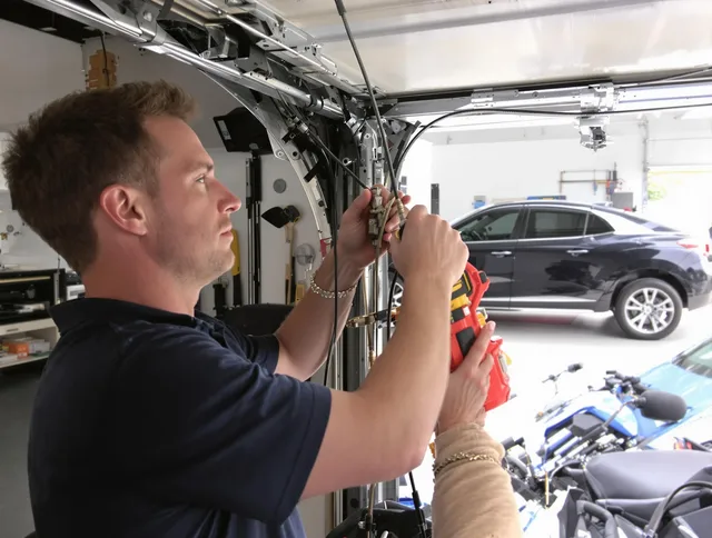 Griswold Garage Door Repair safety certified technician performing cable replacement in Griswold