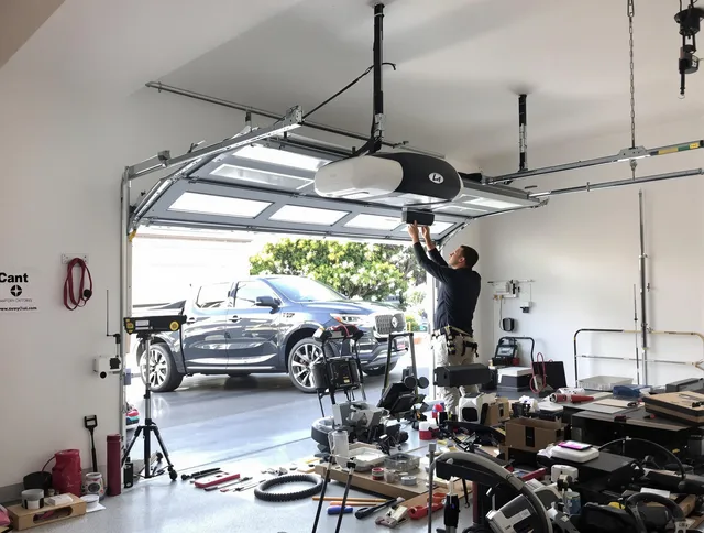 Griswold Garage Door Repair specialist installing smart garage door opener system in Griswold home