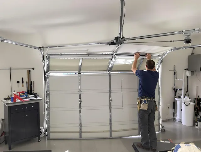 Griswold Garage Door Repair specialist performing precise section replacement on Griswold garage door